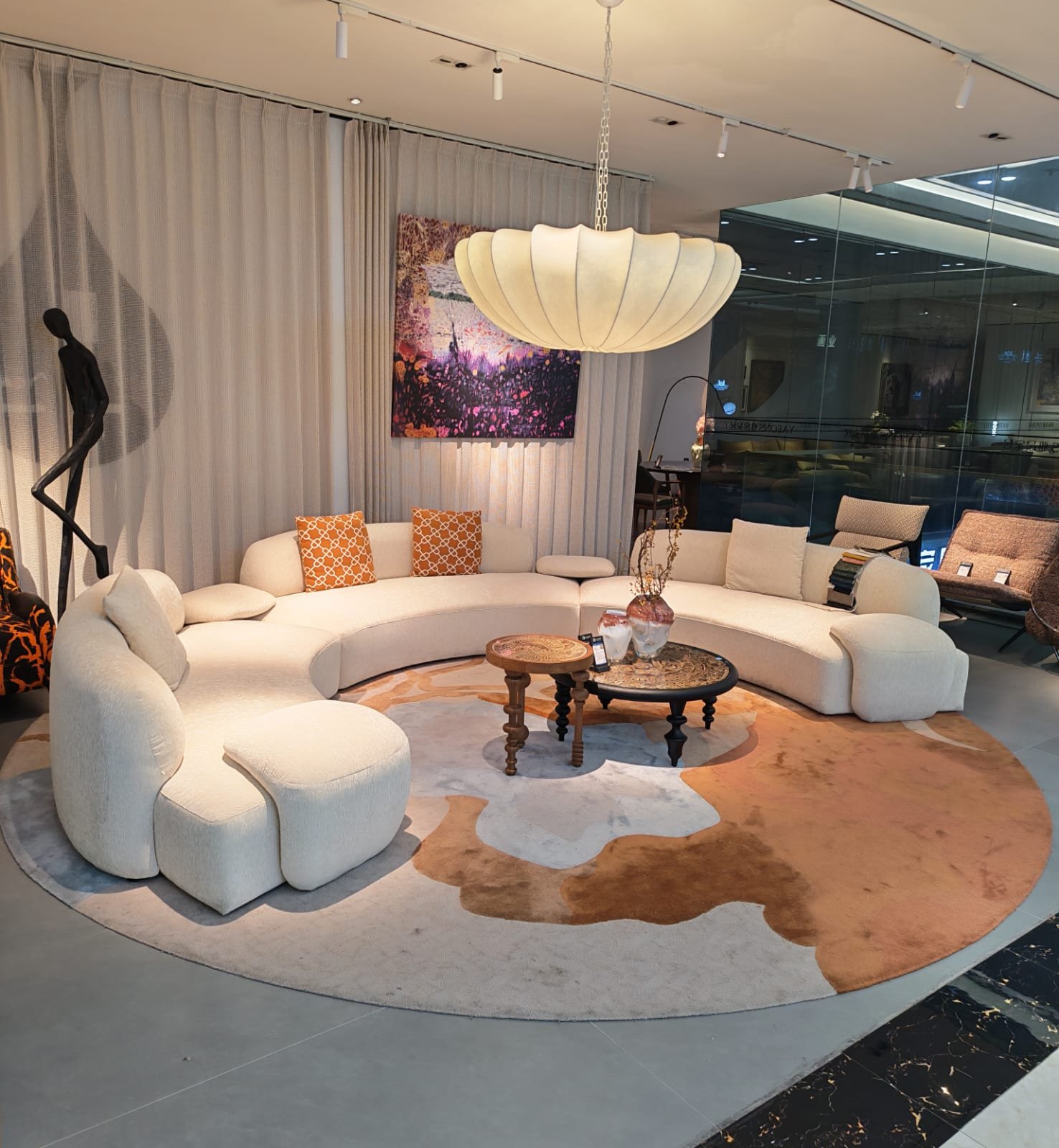 Curved boucle sectional seating in a Foshan Legacy International showroom